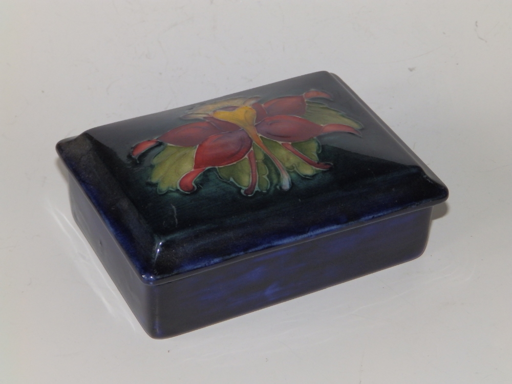 A Moorcroft Columbine pattern rectangular box with lid, dark blue ground, 4.8" across.