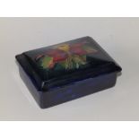 A Moorcroft Columbine pattern rectangular box with lid, dark blue ground, 4.8" across.