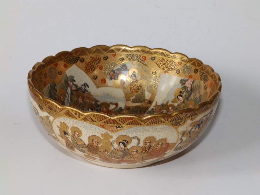 A Japanese Meiji period Satsuma ware bowl decorated with numerous deity figures, scalloped rim,