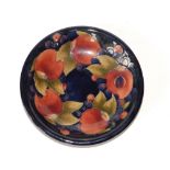 A Moorcroft Pomegranate dish - 'Potter to HM The Queen', paper label & impressed, 7.4" diameter.