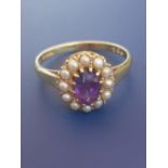 An amethyst & pearl set 18ct gold oval cluster ring - LEB & S. Finger size N - amethyst chipped.