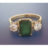 An art deco style emerald & diamond three stone 18ct gold ring - London marks. Finger size S.