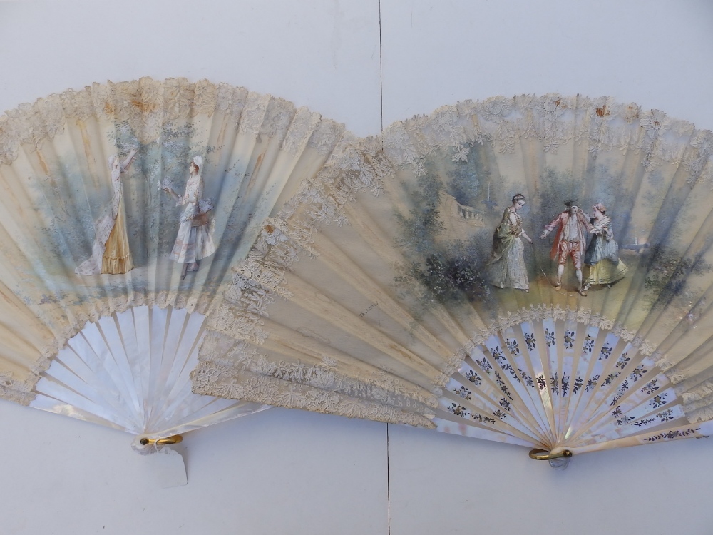 Two large Victorian mother-of-pearl fans, the painted silk leaves decorated with lace, 25.5" & 26"