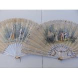 Two large Victorian mother-of-pearl fans, the painted silk leaves decorated with lace, 25.5" & 26"