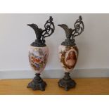 Two continental spelter mounted pink glass ornamental ewers, one decorated with a female portrait,