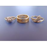An openwork 18ct gold band ring, a diamond cluster and a 9ct serpent ring. (3)