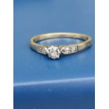 A small old cut diamond solitaire ring, diamonds to shoulders, on 18ct gold shank. Finger size P.