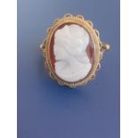 A 9ct gold hardstone cameo ring. Finger size N.