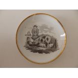 A Spode bat printed plate, decorated in pattern 557 - a farmer with his sow and piglets, gilt rim,