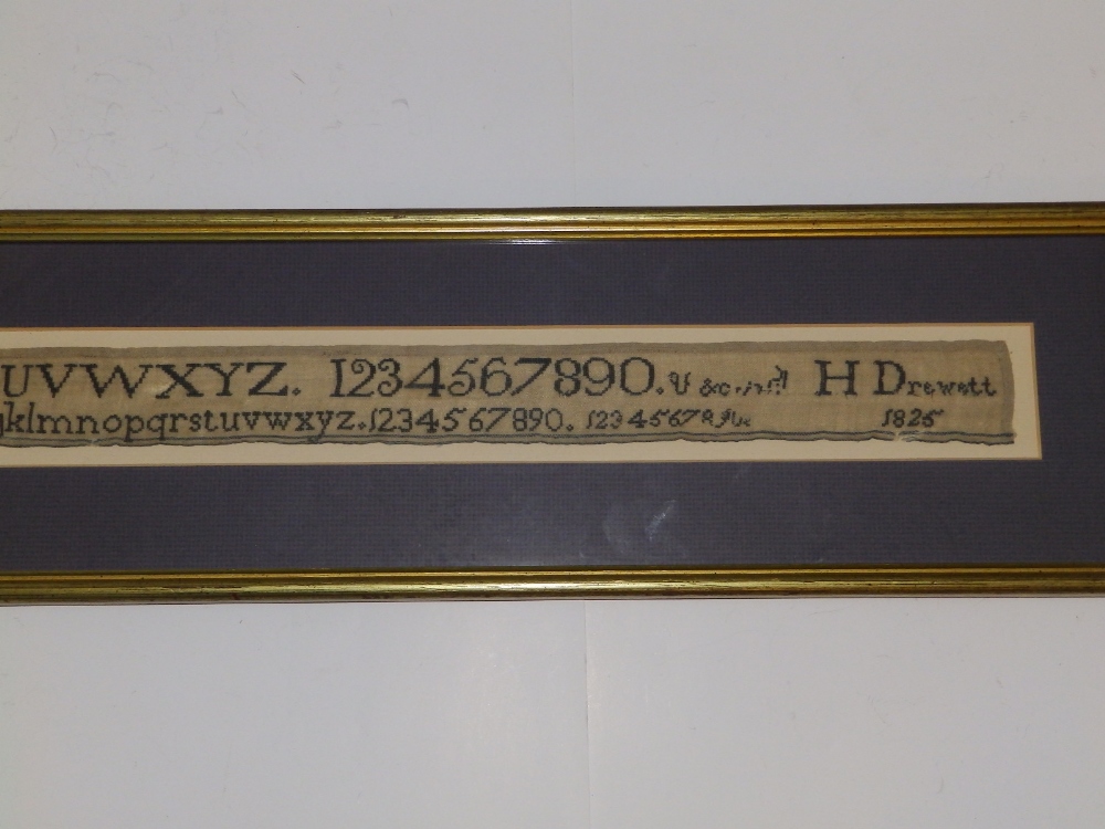 A George IV black silkwork alphabet sampler with numerals, worked by H. Drewett, 1825, 1.5" x 25". - Image 2 of 3