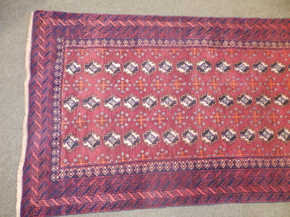 A Bokhara style Baluchi rug, woven with three rows of octagons, 90" x 41". - Image 3 of 6