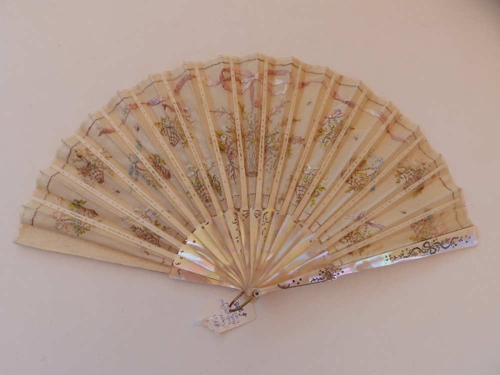 A 19thC mother-of pearl fan, the silk leaf decorated with embroidery and sequins, 15.5" across, in - Image 2 of 3