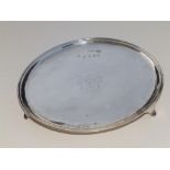 A George I Britannia standard crested silver salver, of plain design, on three bracket feet, the