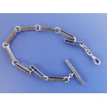 An antique Russian silver watch chain with niello decoration, 11.5" overall.