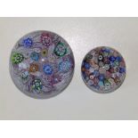A scrambled cane paperweight, 2.75" diameter and a small millefiori paperweight with animal