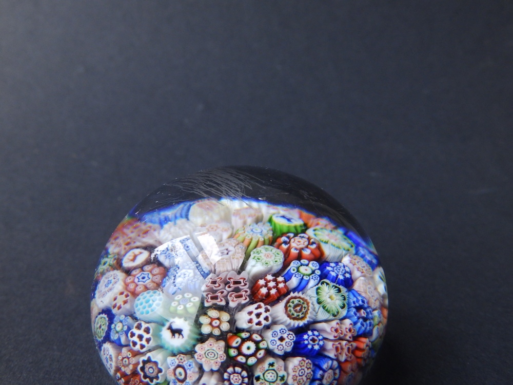A scrambled cane paperweight, 2.75" diameter and a small millefiori paperweight with animal - Image 7 of 8