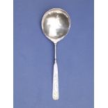 An antique silver spoon, the fig-shaped bowl engraved with numerous initials, a wreath containing '