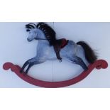 A small painted wood rocking horse, 29" across overall - restored.