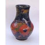 A Moorcroft Pomegranate pattern vase, green painted signature and impressed 'Burslem England M4', 9"