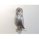 A silver plated caster/pounce pot modelled as an owl with glass eyes, 4" high.