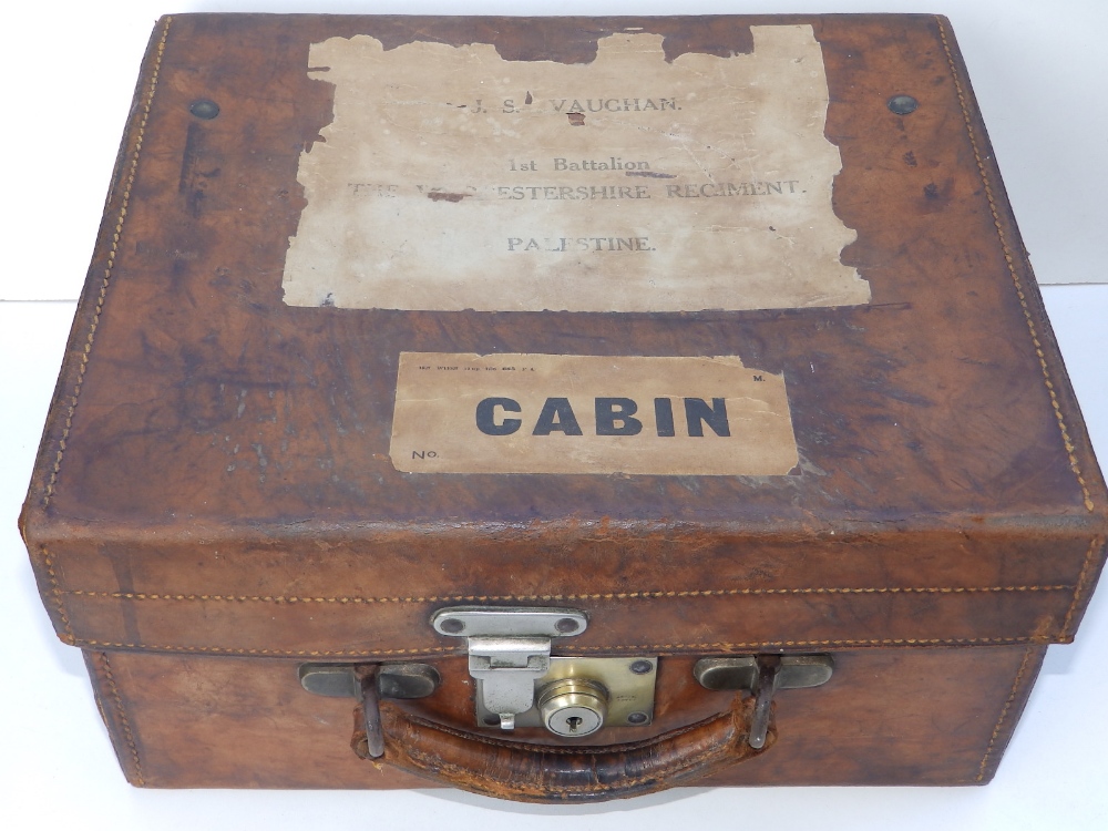 An Edwardian fitted leather travelling case, labelled for 'J.S. Vaughan, 1st Battalion, including