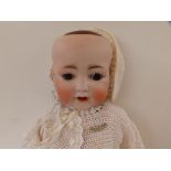 A German bisque head baby doll, with sleeping brown glass eyes, open mouth, composition body -'