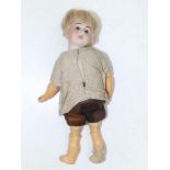 A small Simon & Halbig girl doll with brown glass eyes, jointed limbs, 8".