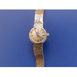 A boxed lady's 9ct gold Omega Automatic bracelet wrist watch - strap a/f.