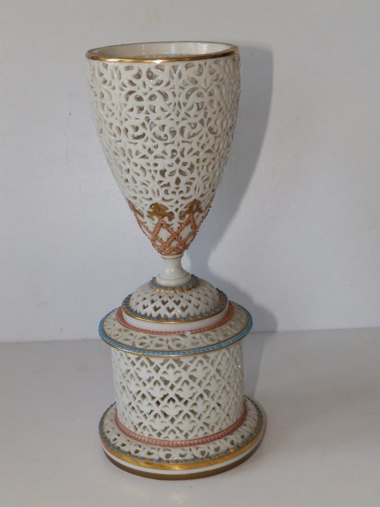 A Graingers Worcester porcelain reticulated stemmed vase standing on circular pedestal, sparingly