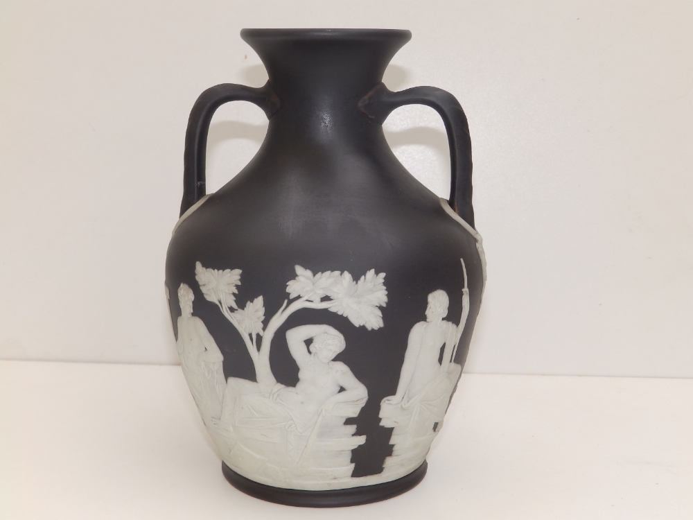 A Wedgwood black jasper copy of the Portland vase, 8.25" high.