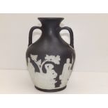 A Wedgwood black jasper copy of the Portland vase, 8.25" high.