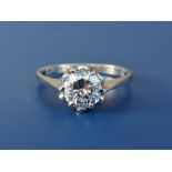 A diamond solitaire, the claw set brilliant weighing approximately 1.4 carats in 18ct white gold.