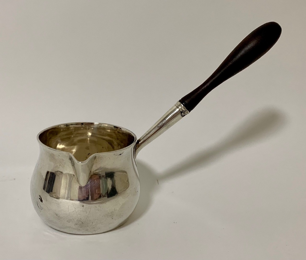 A George III York silver brandy warming pan, of plain bellied form with turned wooden handle -