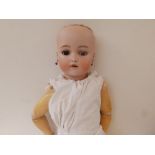 A Simon & Halbig, Kammer & Reinhardt bisque head girl doll, with sleeping brown glass eyes, one