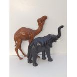 A Liberty style leather model of a camel, 14" high and an elephant. (2)