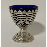 A George III York silver pedestal sugar bowl with blue glass liner, the sides of wrythen lattice