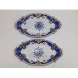 A pair of 19thC shallow oval porcelain dishes, painted with blue & yellow borders, central