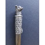 A late Victorian silver mounted rhino horn whip, of sectional form, the silver grip modelled with