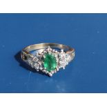 An emerald & diamond set gold ring. Finger size S.