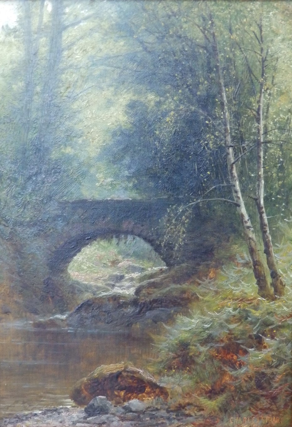 Charles Stuart - oil on canvas - A river with bridge in a forest clearing, signed, 13.5" x 9.5".
