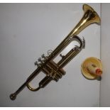 A cased brass & nickel-plated Zenith trumpet with Rudy Muck cushion rim mouthpiece, 21.75" overall.