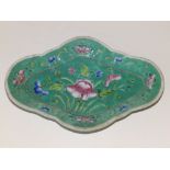 A Chinese turquoise glazed porcelain shallow quatrefoil dish decorated flowers, 11.2" across.