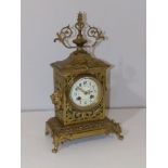 A 19thC gilt brass French mantel clock by Vincenti, having convex enamel dial painted flowers, 14.5"