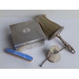 A Mappin & Webb presentation silver cigarette box, a brush, a blue enamelled nail buffer and a