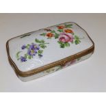 A continental gilt metal mounted porcelain trinket box, decorated with polychrome flowers and bianco