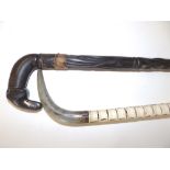 A shark's vertebrae walking stick, 35.5" and one other - a/f. (2)