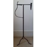 A wrought iron candle holder & rush light, 12.5" high