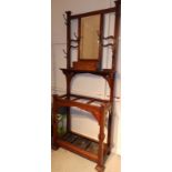 An Arts & Crafts walnut hallstand with mirror & glove box, Height 80", Width 31".