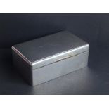 A plain silver cigarette box - Mordan & Co., London 1919, 5.75" across.