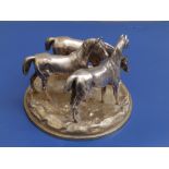 A parcel-gilt silver equestrian centrepiece by Robert Hennell, modelled as three horses on a